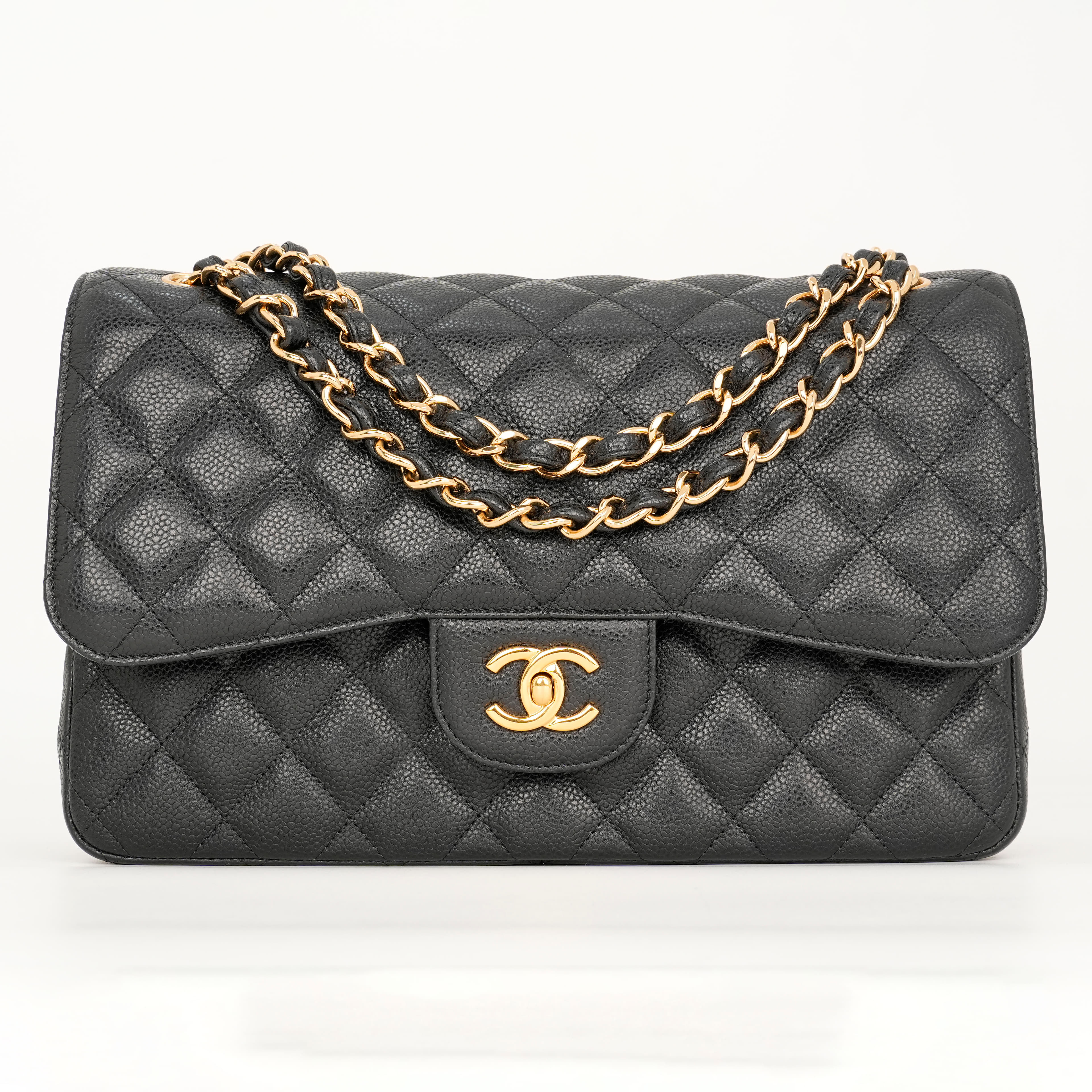 Chanel Jumbo Classic Flap Bag in black caviar leather with gold-tone hardware
