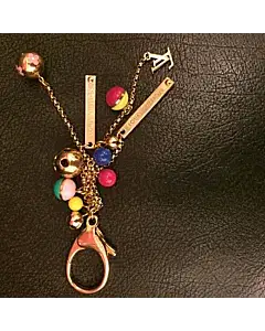 Louis Vuitton Gold-tone Mini Lin Croisette LV logo monogram keychain