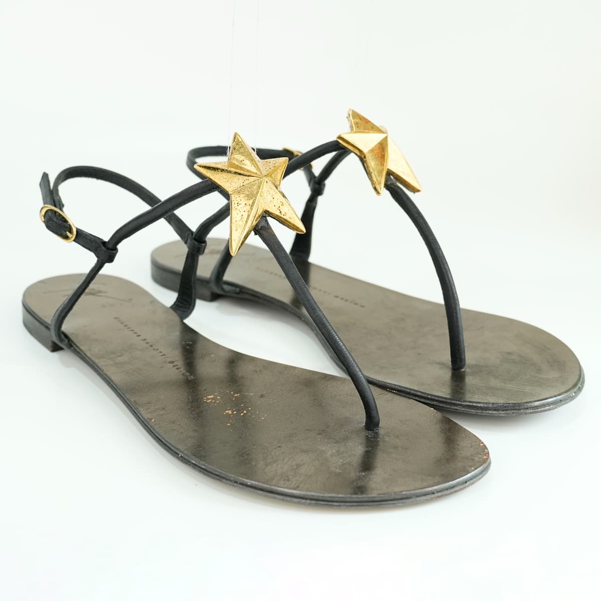 Size 40.5 - Giuseppe Zanotti black leather thong sandals with gold star charm